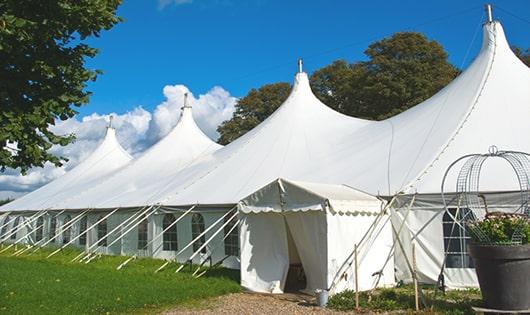 a line of sleek and modern portable restrooms ready for use at an upscale corporate event in Rexford